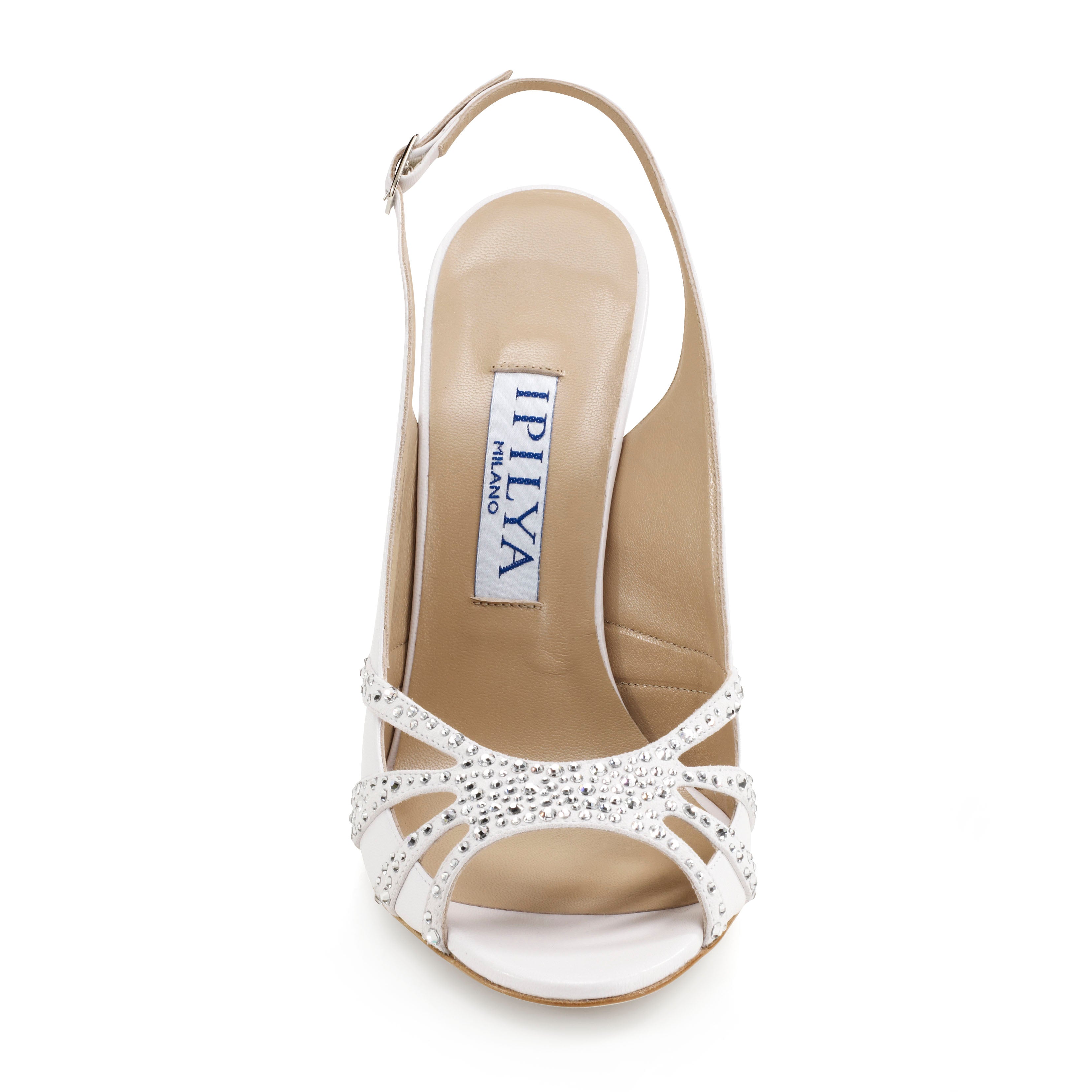 Elegant white leather bridal shoes featuring intricate Swarovski crystal detailing for a timeless wedding look.